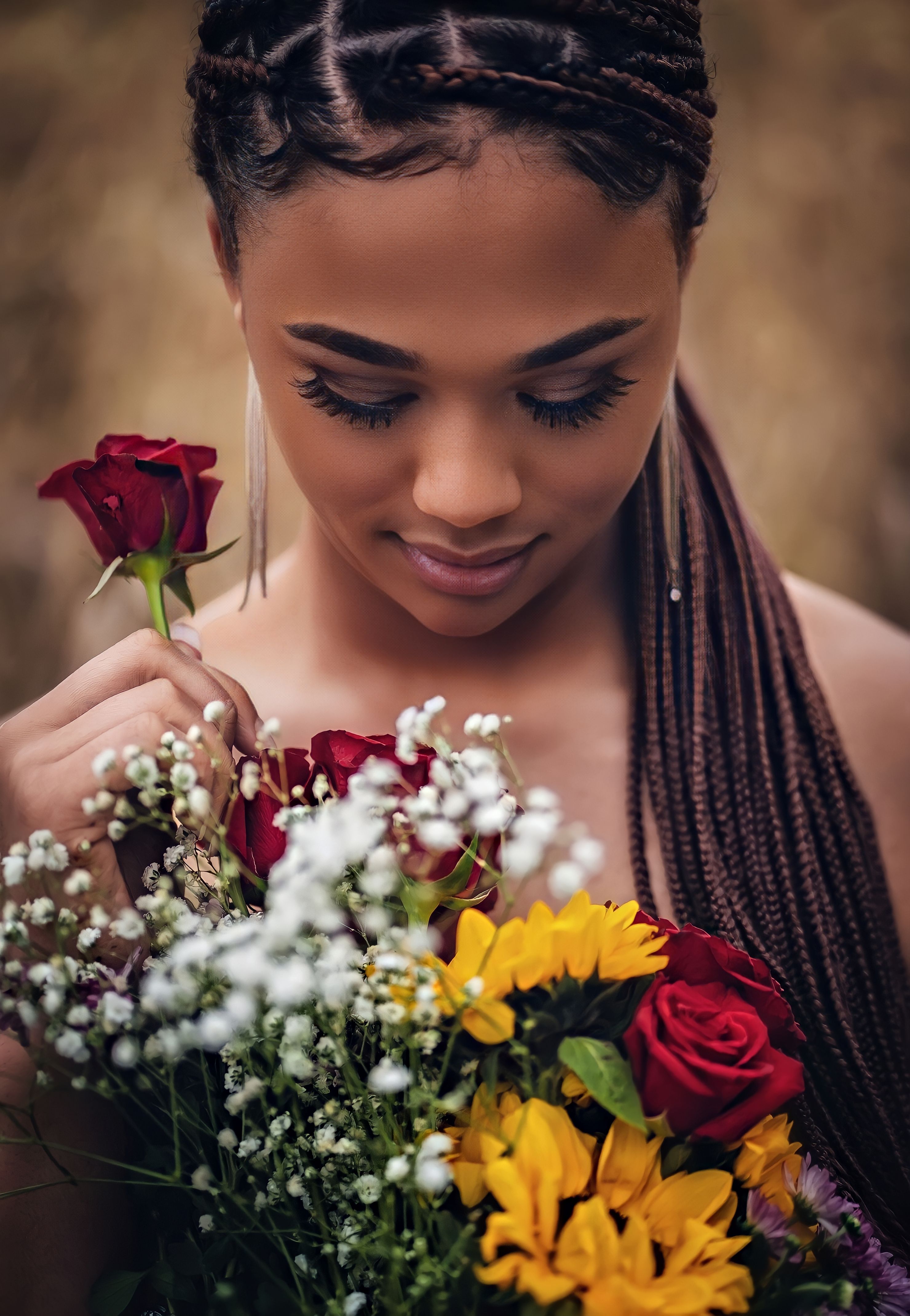 Fine art portrait focusing on jewel-toned nail art with soft feminine backdrop