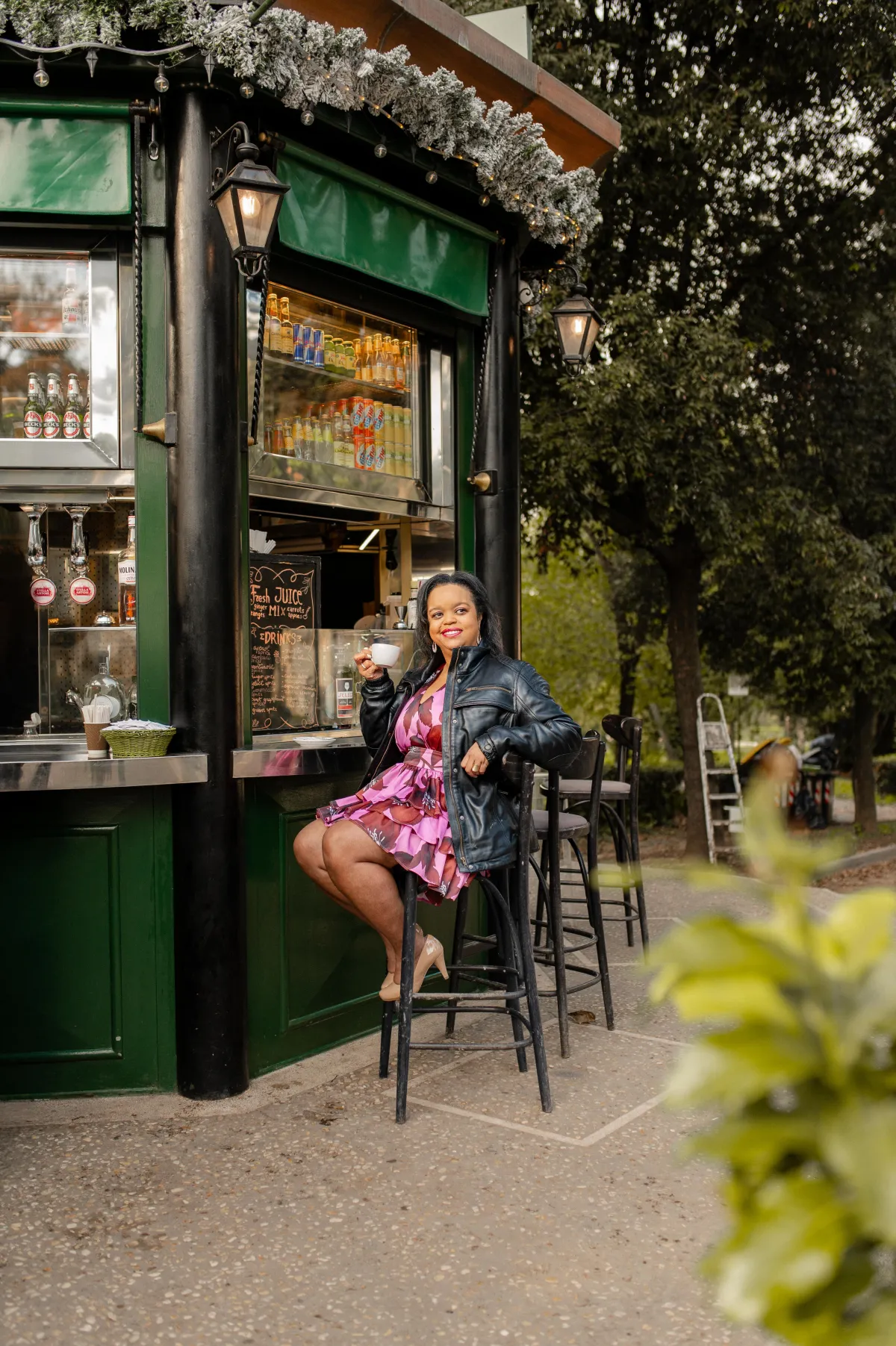 jasmin bryant sitting at a coffee kiosk in Rome