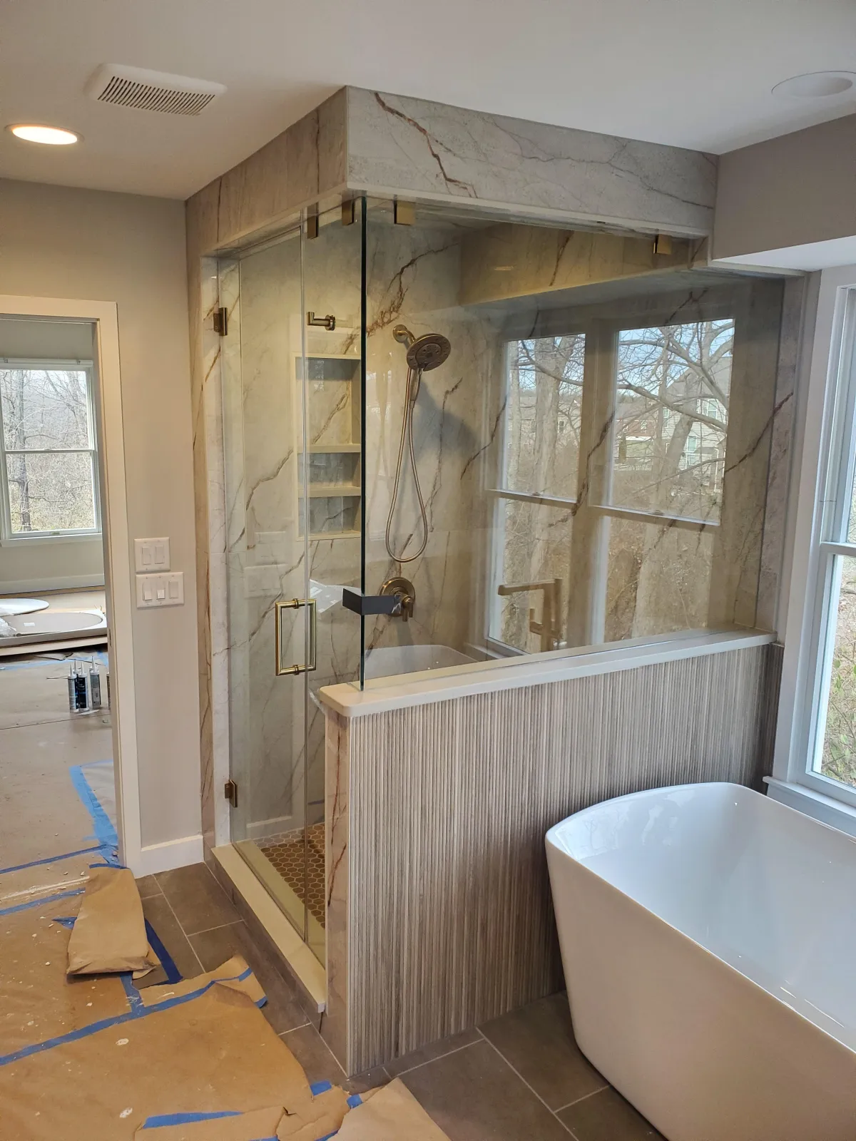 Close-up of shattered bullet-resistant glass showing impact pattern from ballistic testing – installed by RDB Glass for high-security commercial protection in Dayton, OH.