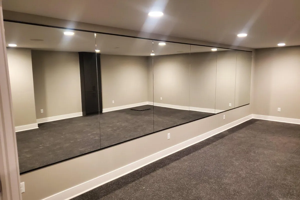 Home gym or studio featuring full-length custom wall mirrors installed by RDB Glass in Dayton, OH – ideal for decorative and functional residential mirror solutions.