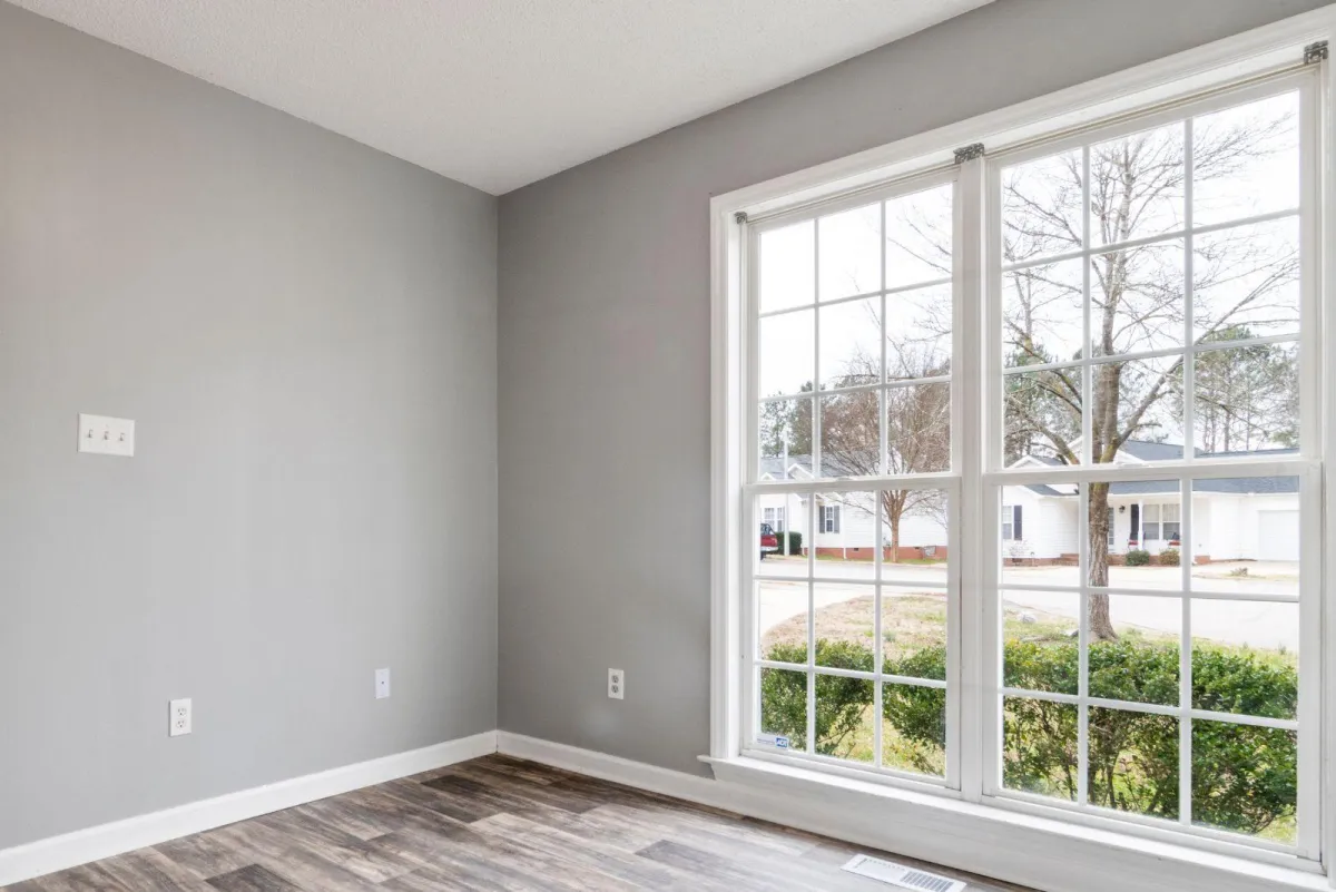 Bright living room with newly installed energy-efficient glass windows in a modern home – RDB Glass window replacement services Dayton, OH.