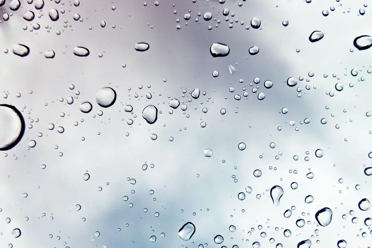 Close-up of water droplets on residential window glass showcasing clarity and waterproof seal – RDB Glass Residential Glass Services in Dayton, OH.