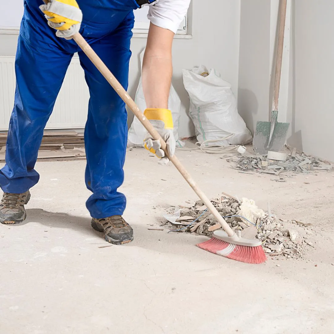 Someone sweeping at a construction site