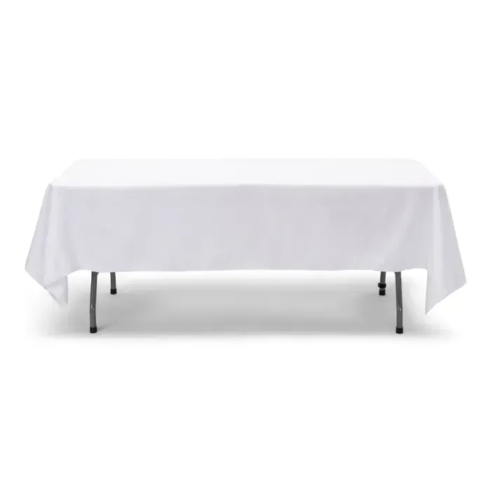 Elegant white linen tablecloth draped over a round table, set for a formal dinner