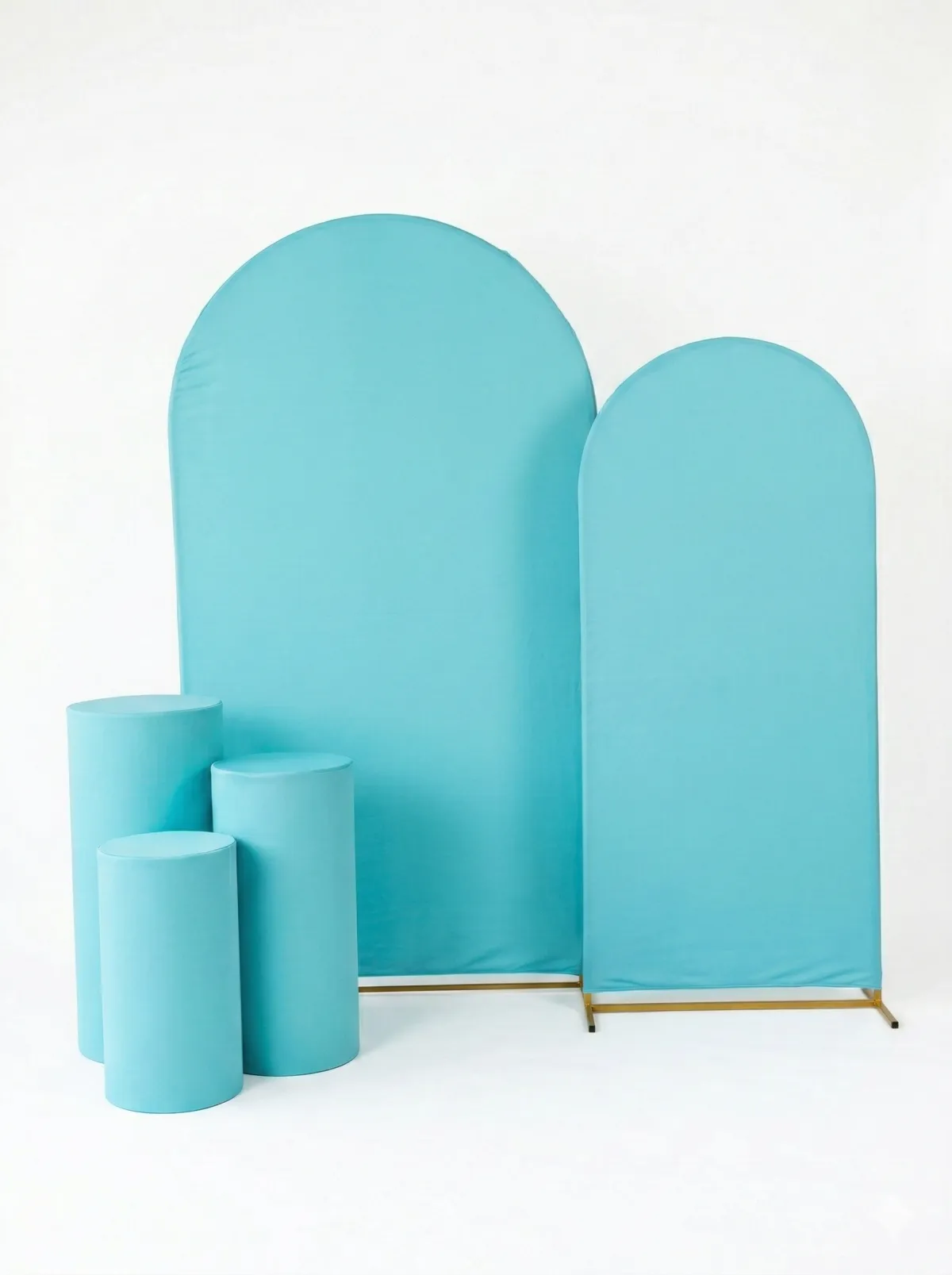 A round banquet table with a crisp white finish, elegantly set for six guests, placed in a sunlit event space with minimalistic decor.