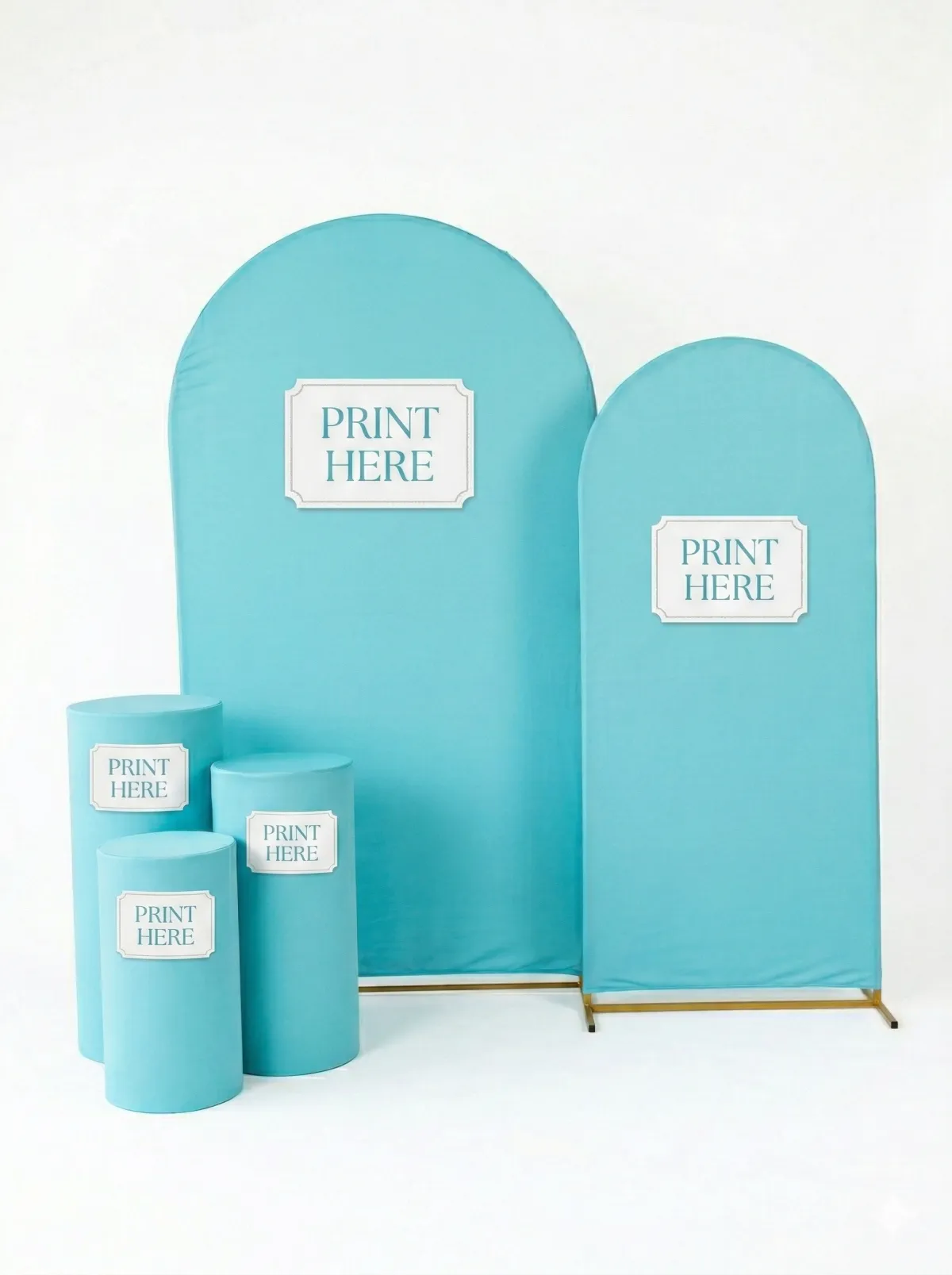 A rectangular farmhouse-style wooden table with a rustic finish, set up for a buffet in a lush garden setting.