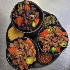 a view of a small town in the mountains