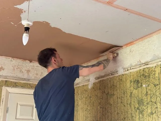 Smooth plastered interior wall with warm, soft light