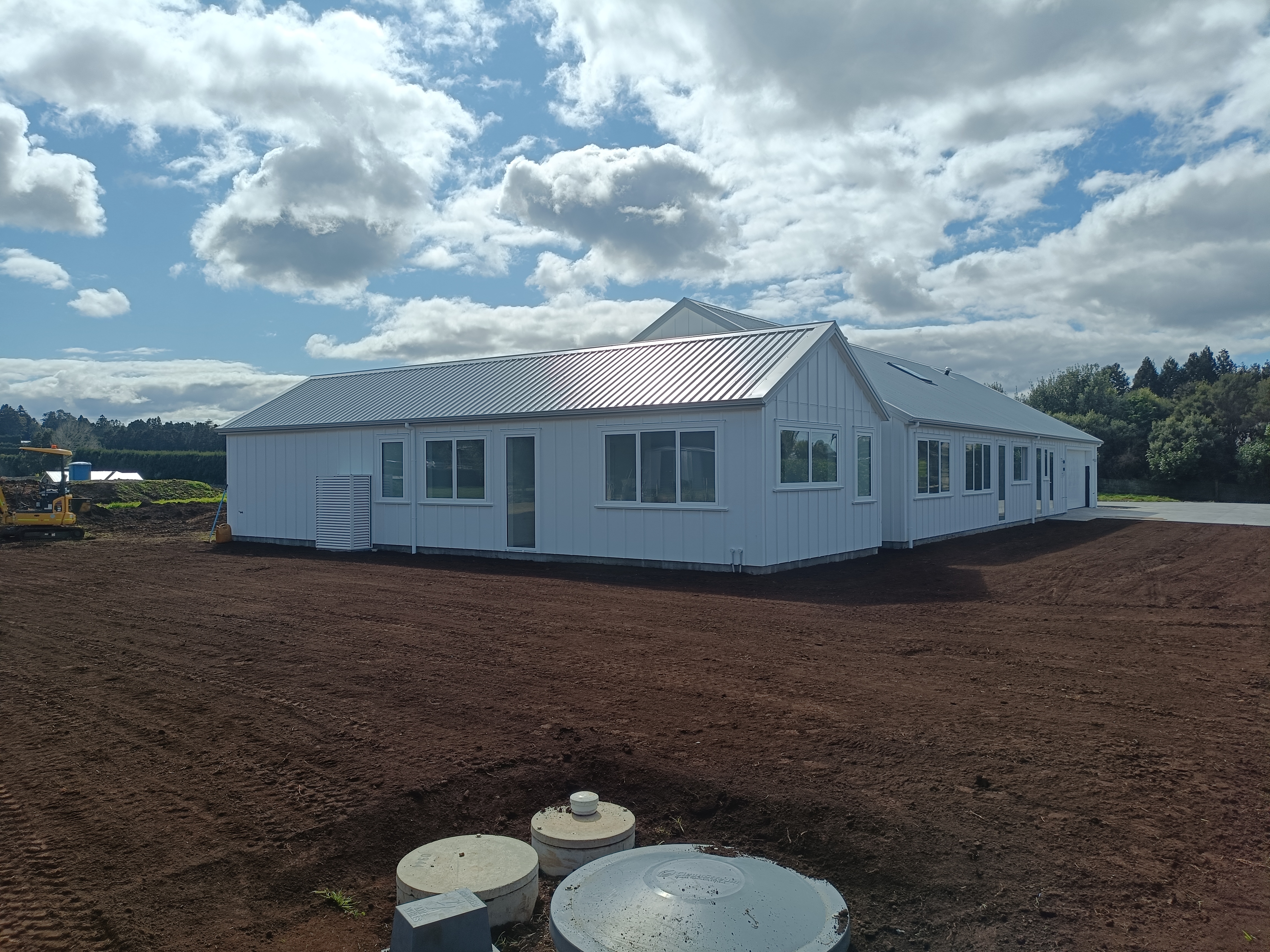 Aspect Contracting project collage showing kauri‑safe bush tracks, earthworks and retaining work in Whangarei, Northland
