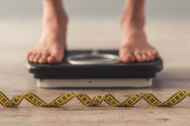 Busy professional looking frustrated with stalled fitness progress