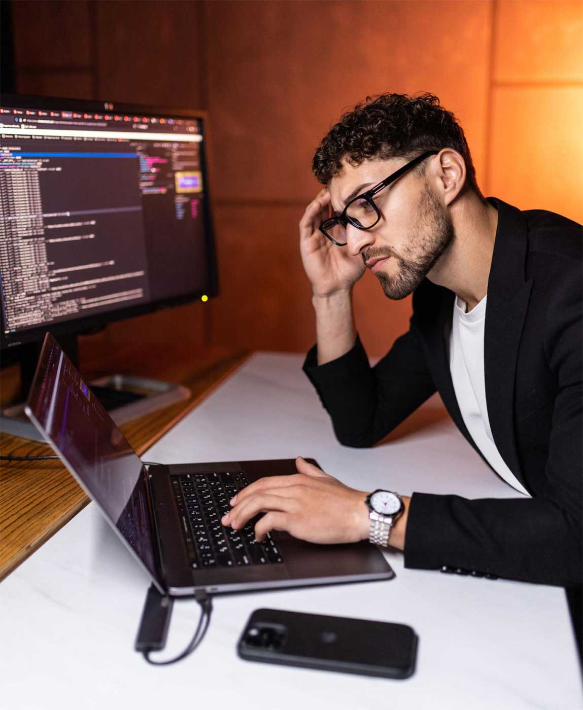 Student coding on a laptop