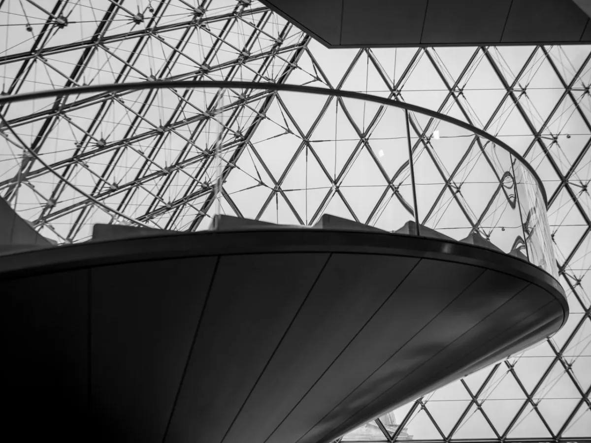 triangle ceiling and metal staircase in the Louvre