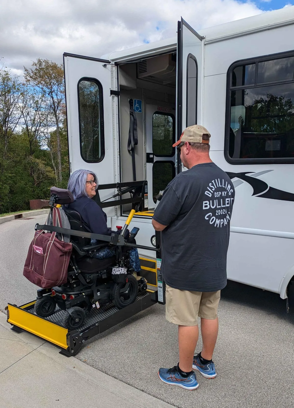 Heather on the lift for an accessible bus