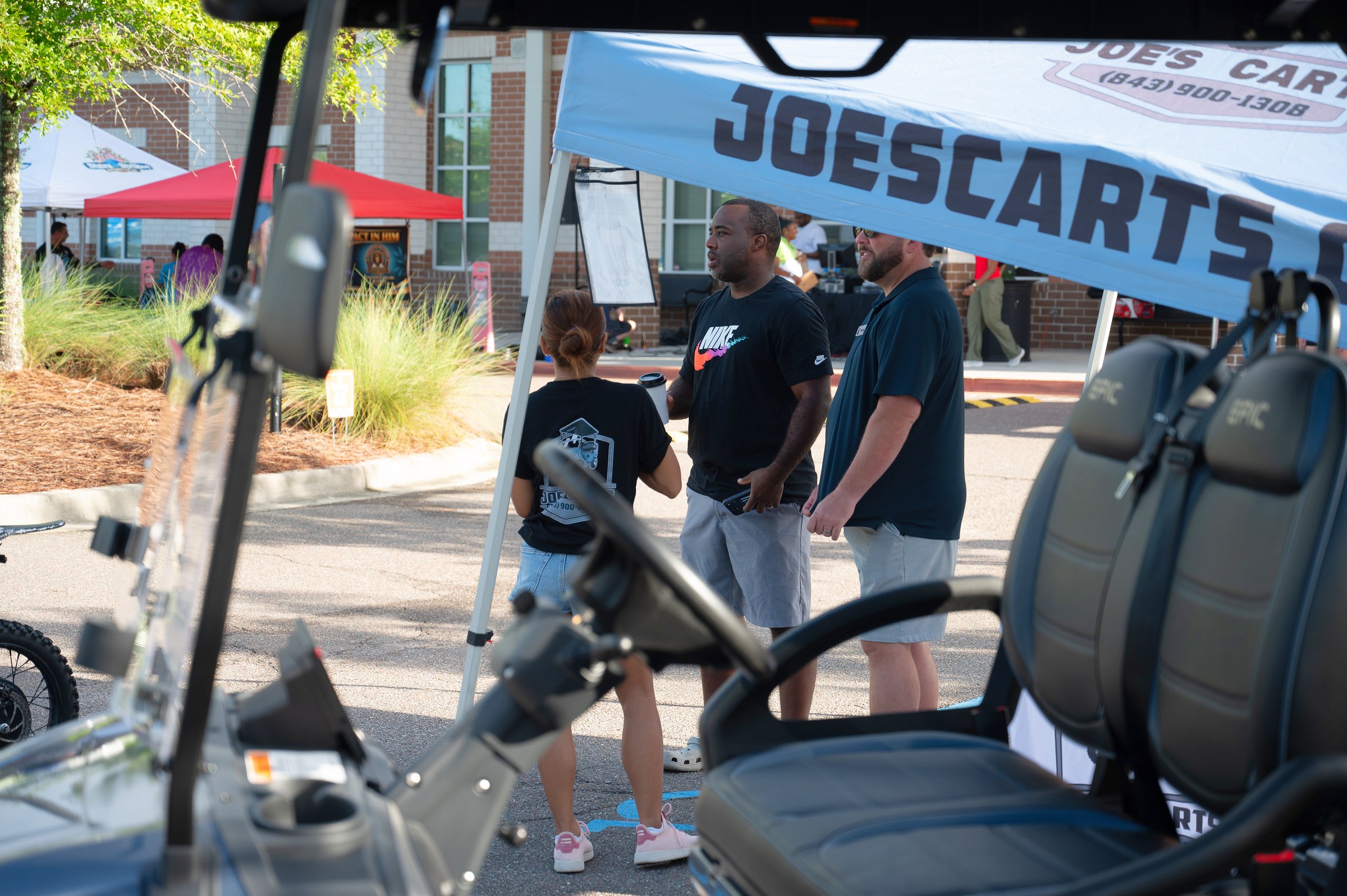 Cantey FoundatioJoe's Carts team talking with visitors at the 2026 marketn Specialists booth at the 2026 Summerville Destination Market