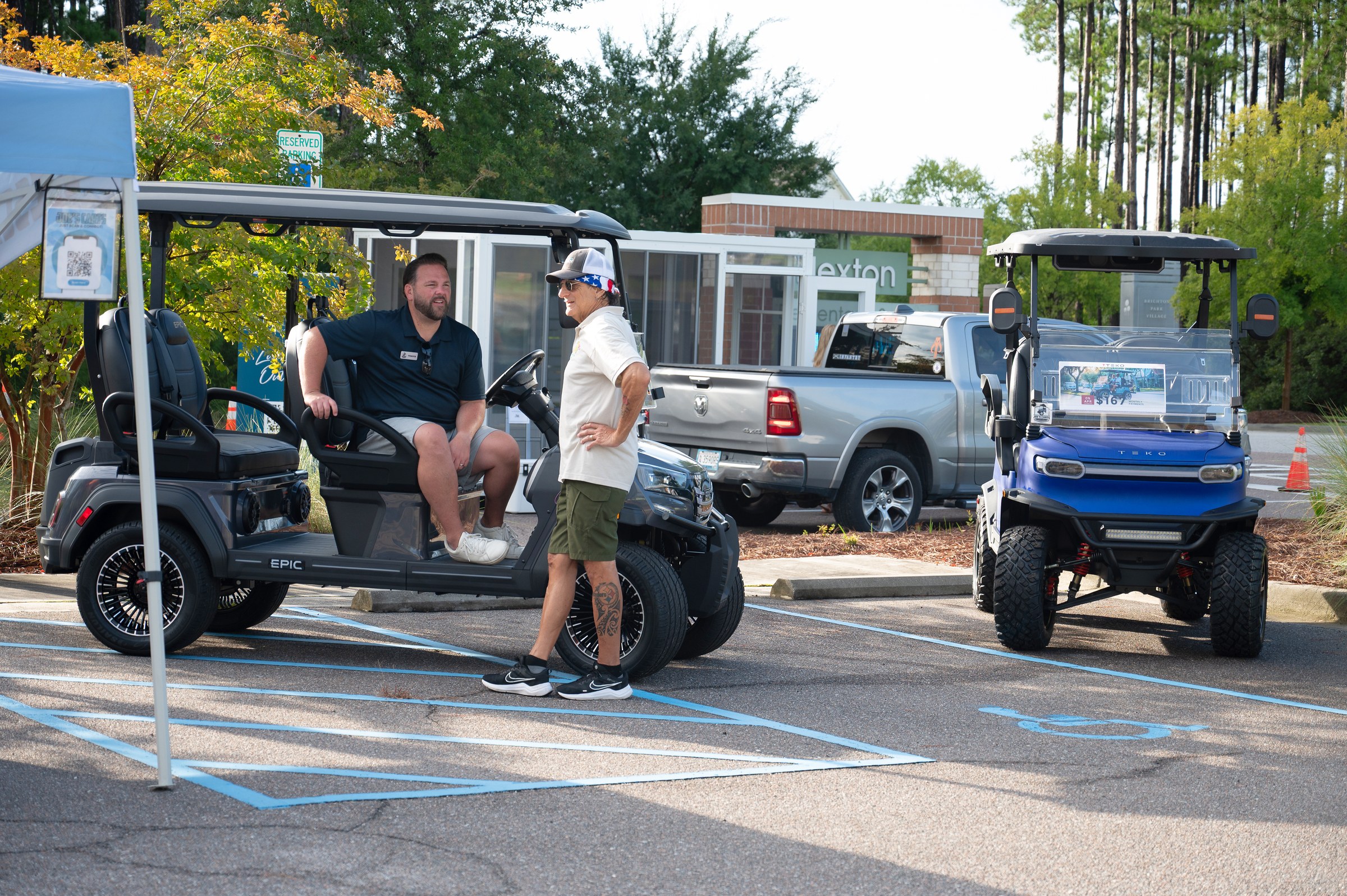 Golf cart display and conversation at the 2026 market