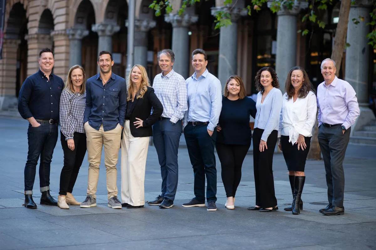 person holding orange flower petals