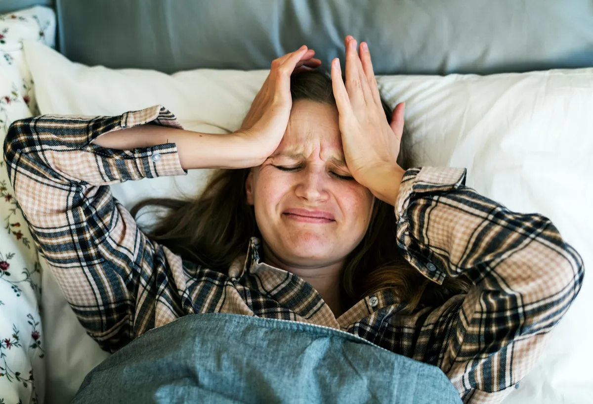 a woman with a severe headache
