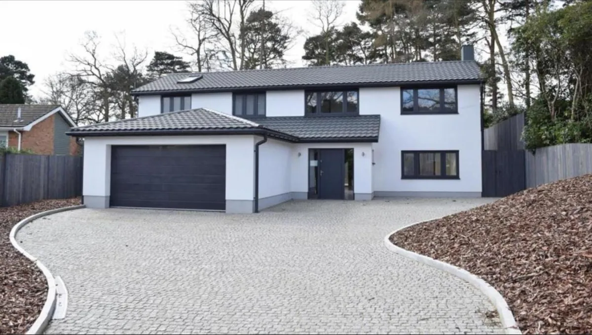 3D CGI render of a modern two-storey new build with large glass doors and child-friendly garden in Woking