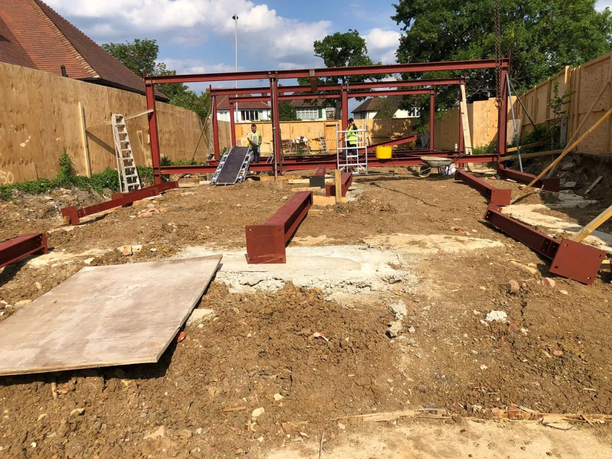 Steel frame installation underway for new build foundation structure in Woking