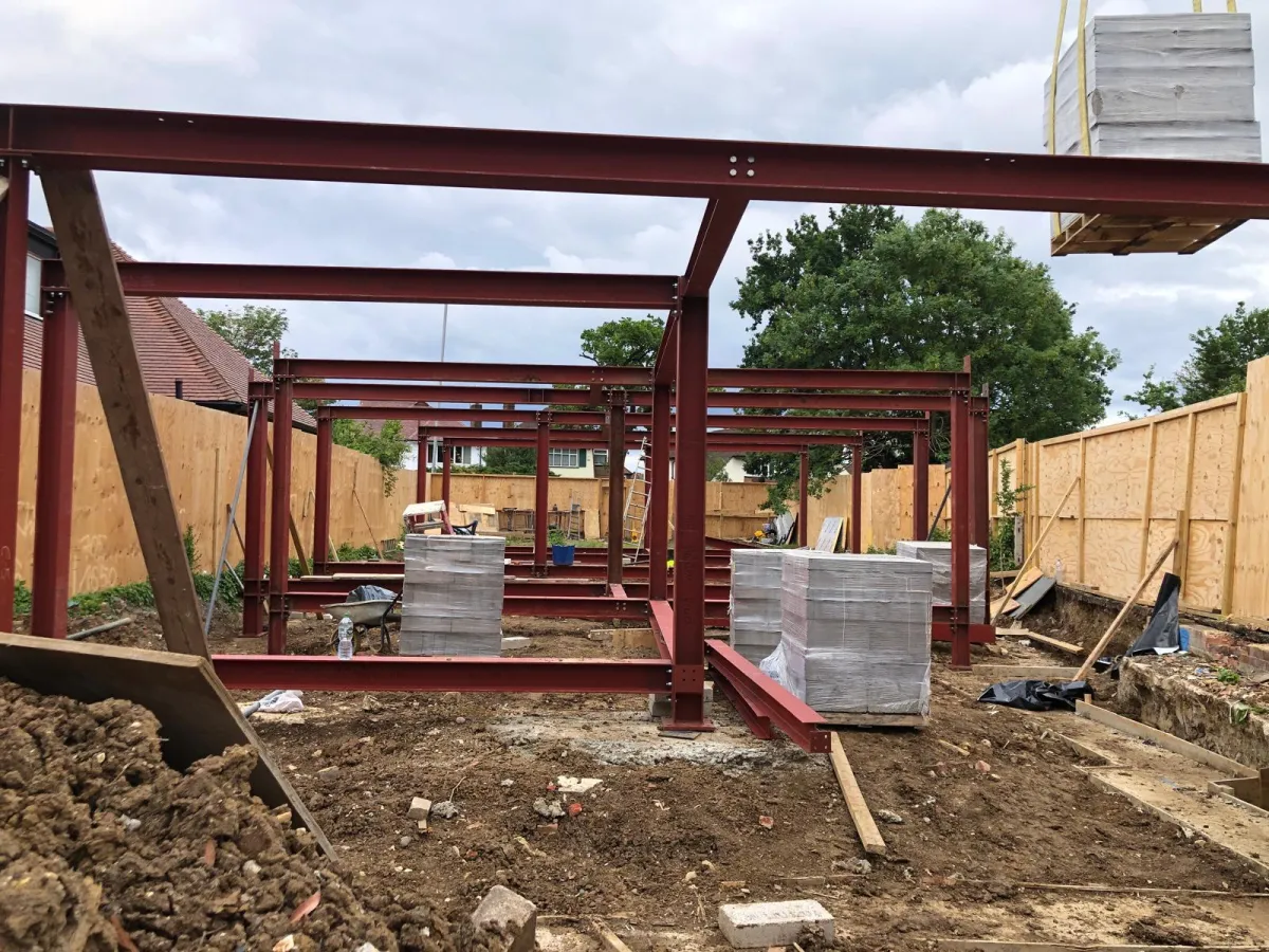 Close-up of steel framework and construction materials on a new residential build site in Woking