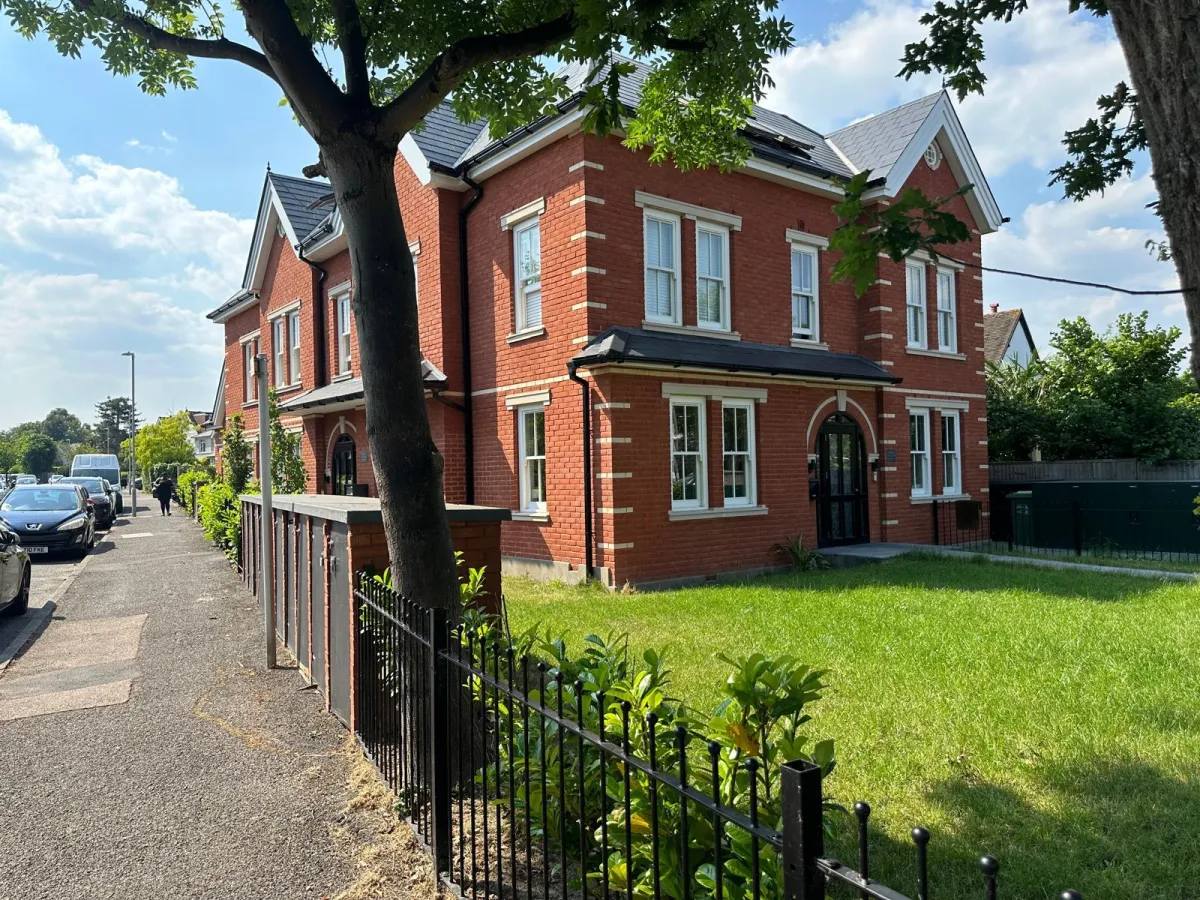 Completed traditional-style red brick new build home with landscaped front garden in Leatherhead