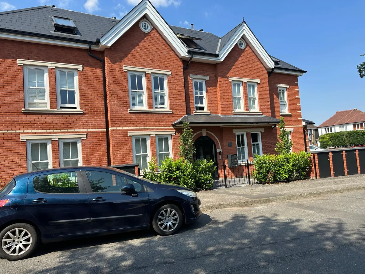 Pair of modern red brick semi-detached new build houses in residential London neighbourhood