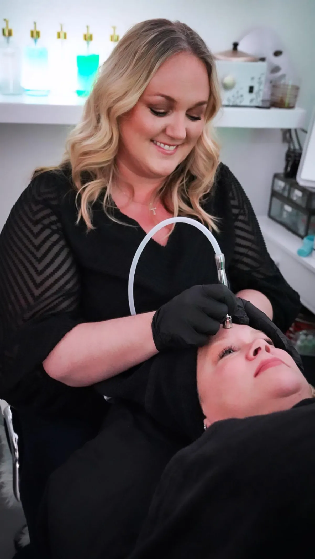 Client receiving a anti-aging, exfoliating, deep cleaning treatment by Lindsay Rose Ali at Lindsay Rose Beauty in Mansfield, Texas