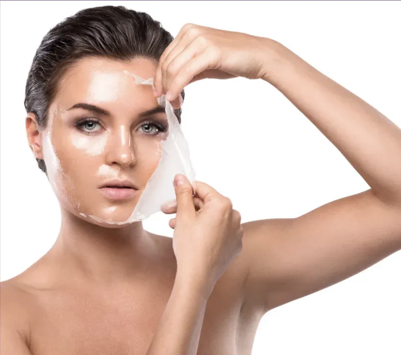 picture of woman demonstrating peeling off the needle free filler facial mask by Lindsay Rose Ali at Lindsay Rose Beauty in Mansfield, Texasf