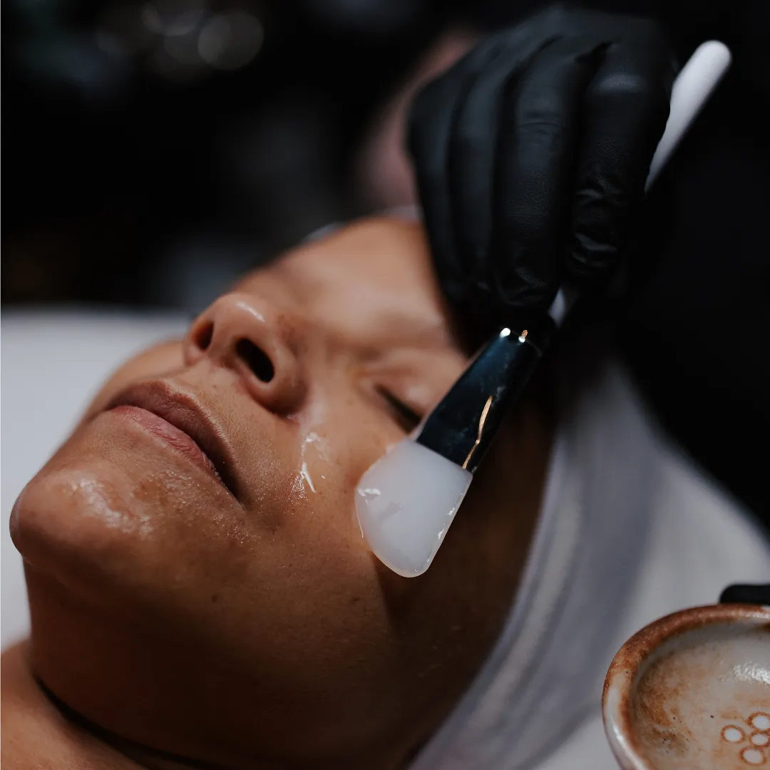 Client receiving a anti-aging, exfoliating, deep cleaning treatment by Lindsay Rose Ali at Lindsay Rose Beauty in Mansfield, Texas