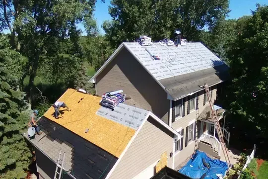 lacey roofing contractors working on roof in lacey