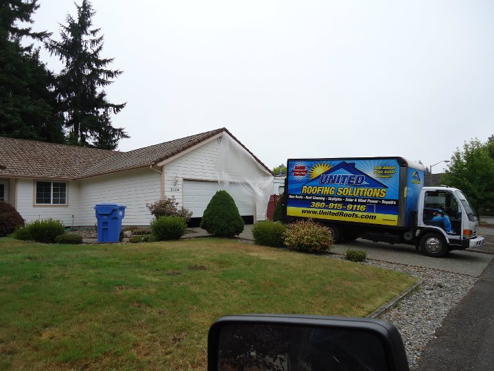 crew installing a roof in lacey