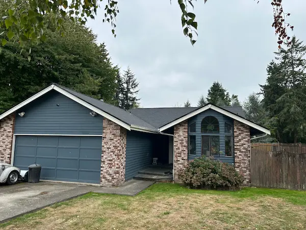 Lacey home with new roof after full roof replacement near 15th Ave NE, Lacey WA 98516 - United Roofing Solutions