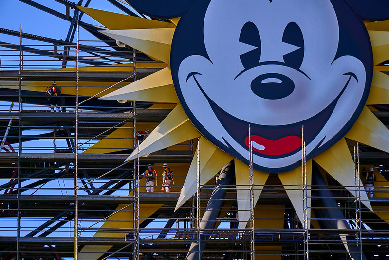 Constuction Workers give a sense of scale to the giant Mickey Mouse face.
