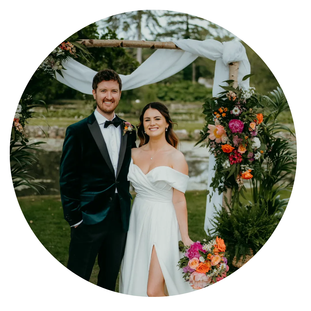 Couple in Front of Wedding Ceremony Backdrop