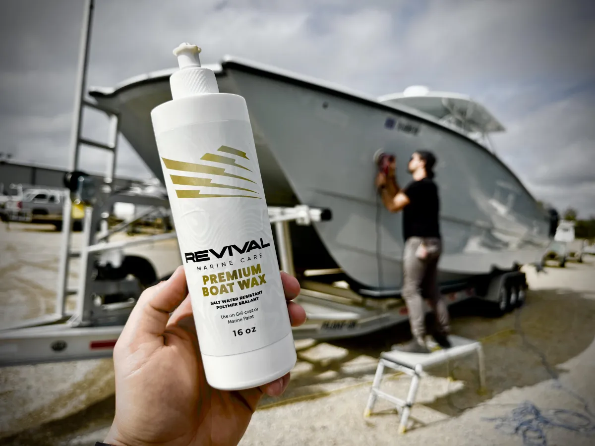 Oxidation removal and gel coat restoration on a white fiberglass boat