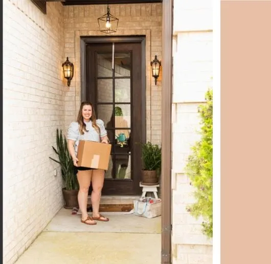 girl holding her topanga scents product pack at front door