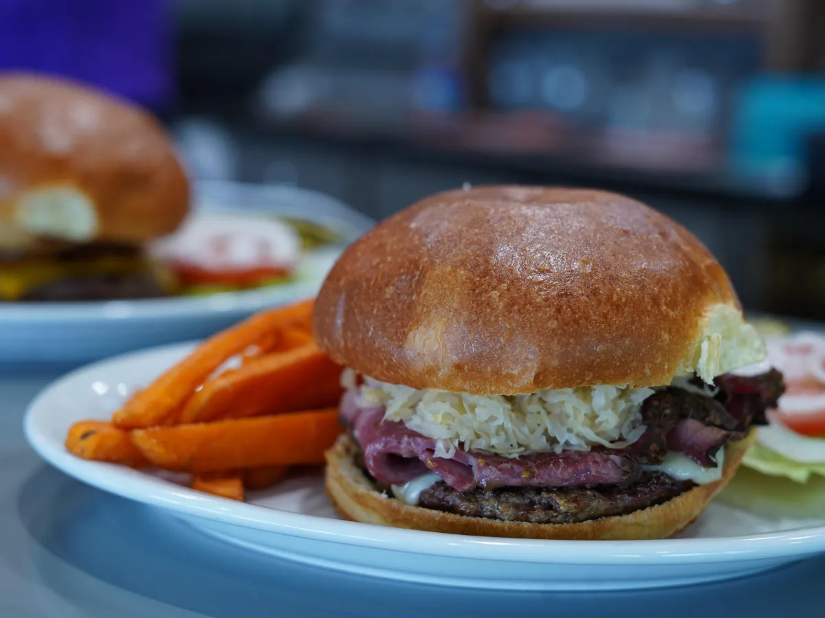 Reuben sandwich with veggie side dish
