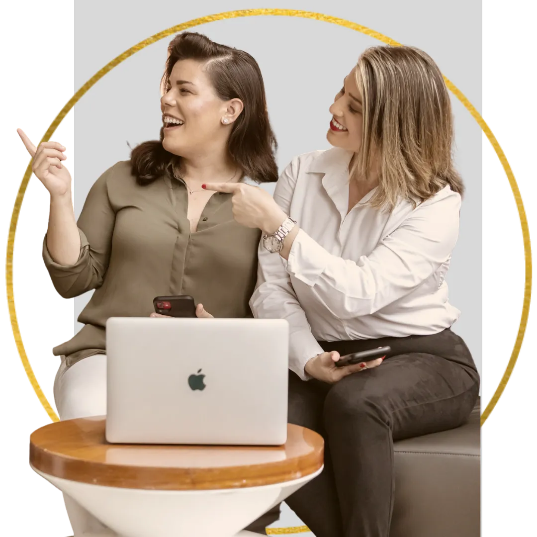 Image of Isabel and Vanessa pointing to the left.