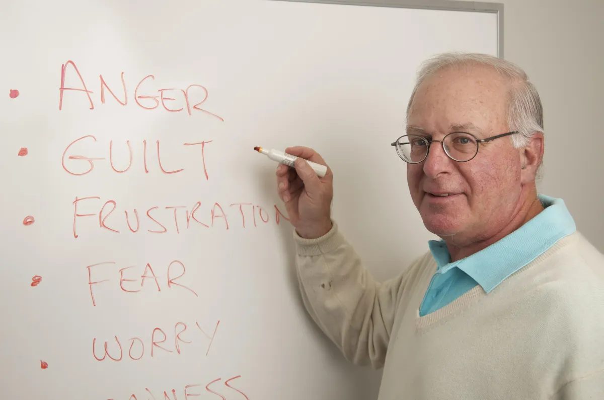 Dr. Mort using a whiteboard