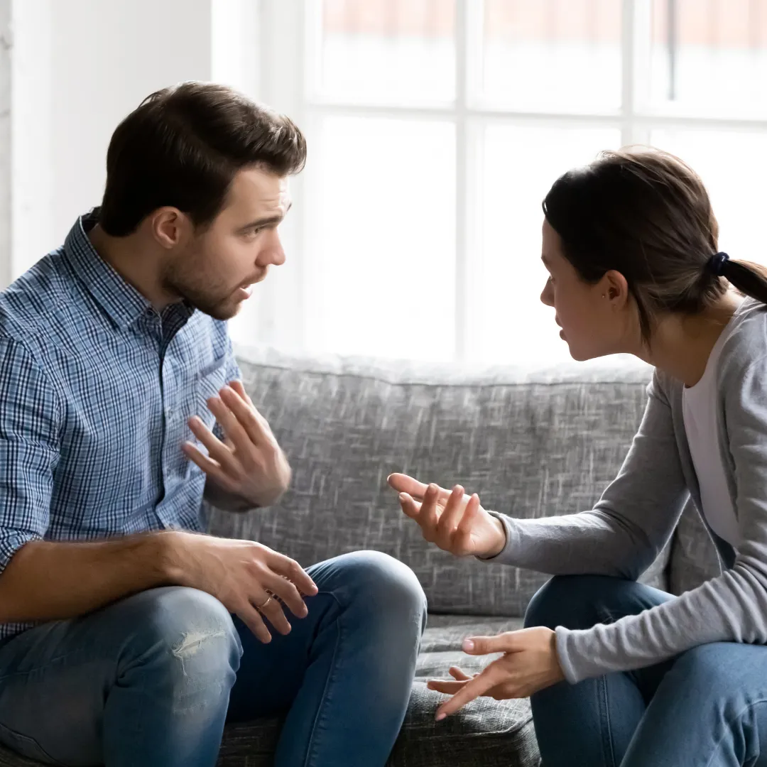 couple arguing on couch