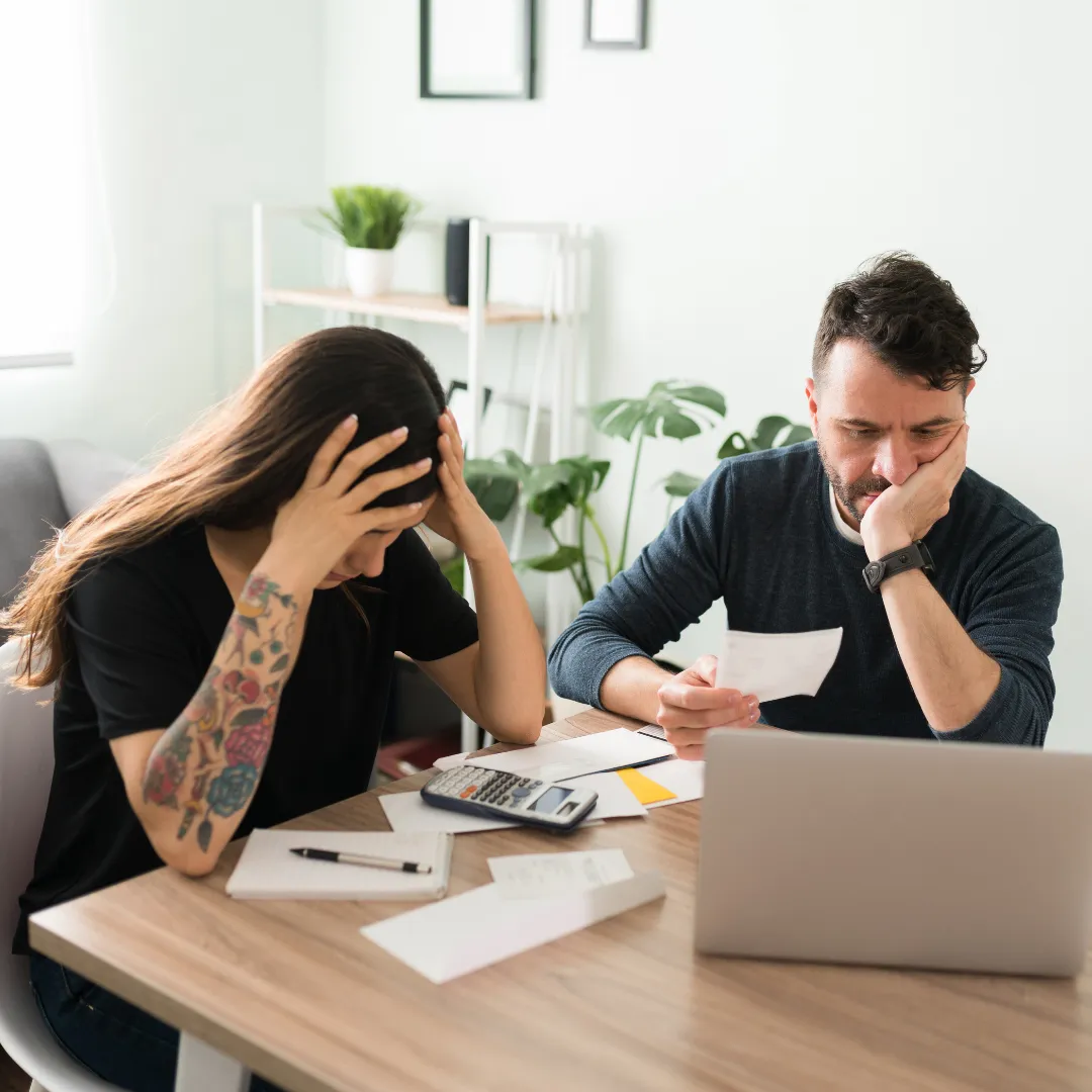 frustrated couple on computer disagreeing