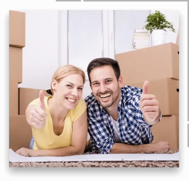 happy couple with moving boxes