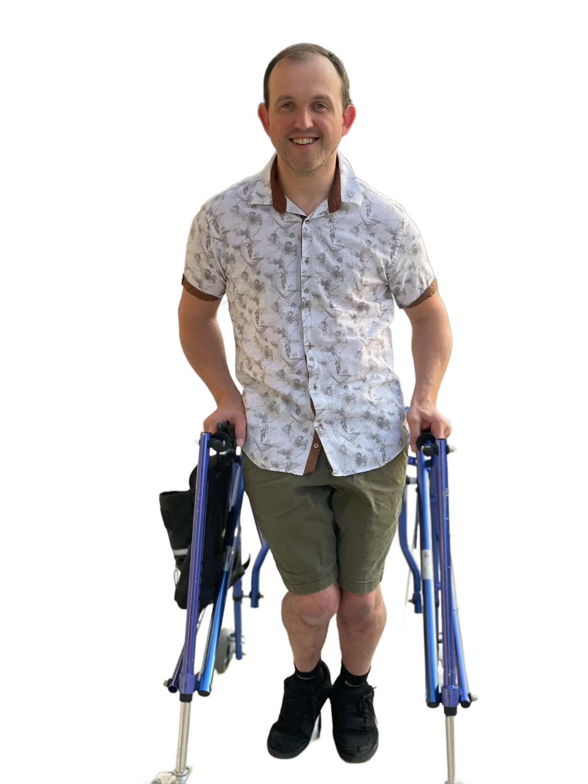 Jack standing in his blue walker with a white dress shirt