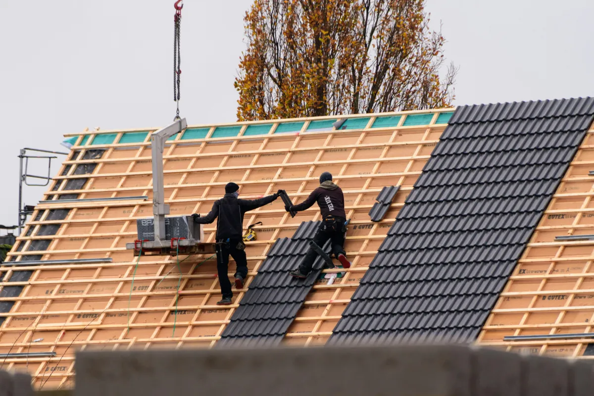 Roofers work efficiently