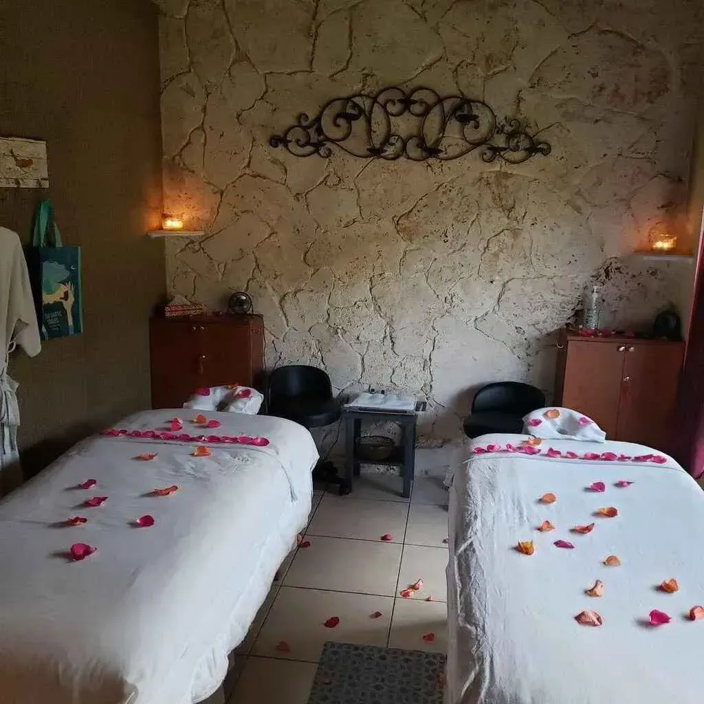 white and brown concrete buildings near snow covered mountain during daytime