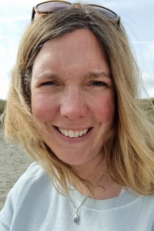 Image of Rae outdoors (on the beach) around the time she left the NHS