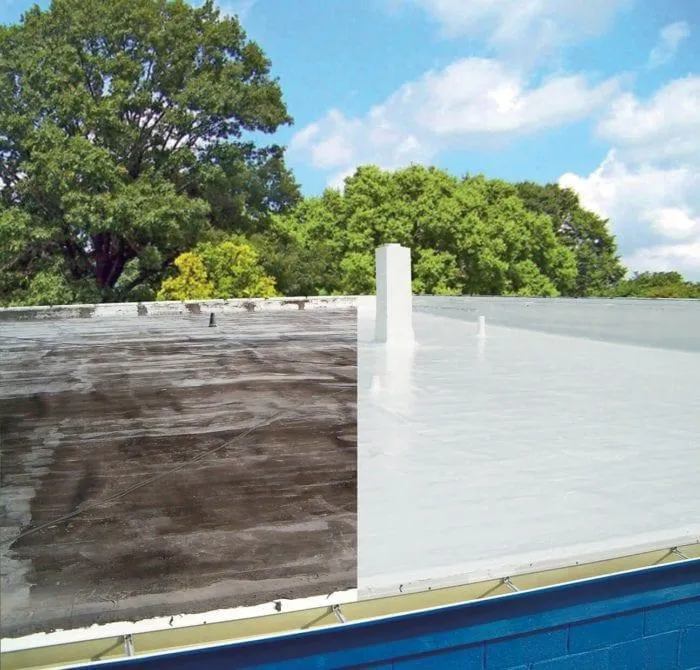 worker repairing roof with silicone