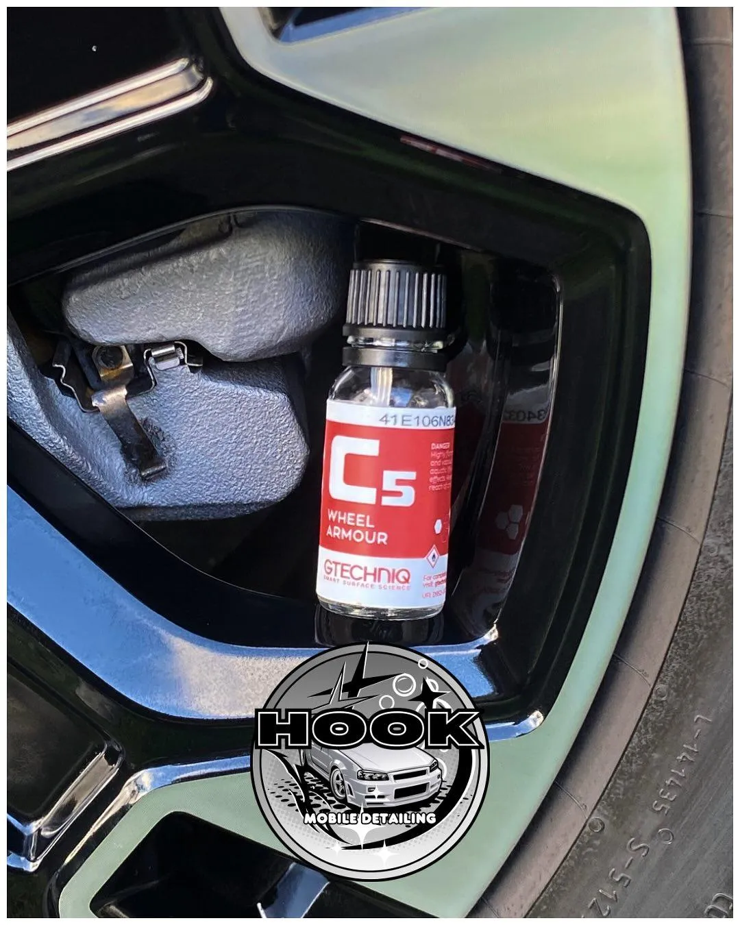 image of GTECHNIQ C5 in a wheel rim after car detailing job done by HOOK Mobile Car Detailing and Ceramic Coatings. image also has HOOK Mobile Car Detailing and Ceramic Coatings' logo