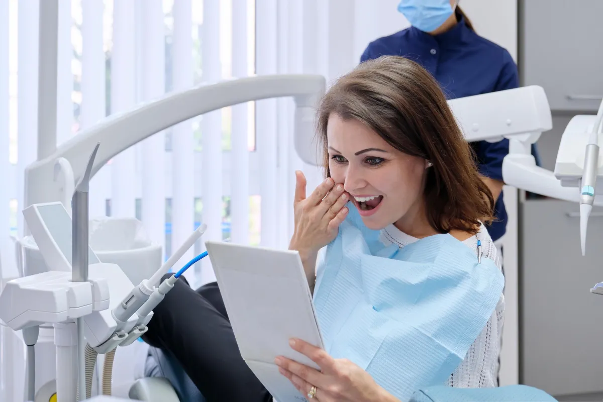 Patient happy with the results of getting her teeth done