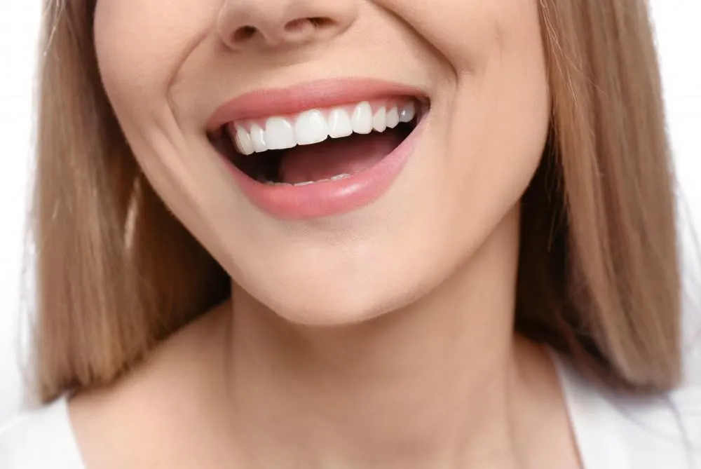 patient confident with her beautiful teeth with composite veneers